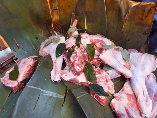 Prepping lamb meat for barbacoa in Mexico City