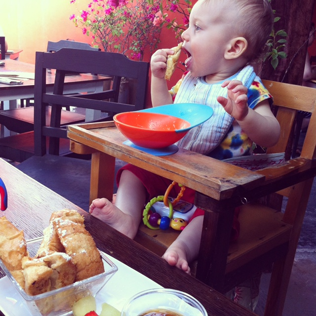 Toddler eating with Boon Catch bowl in Mexico