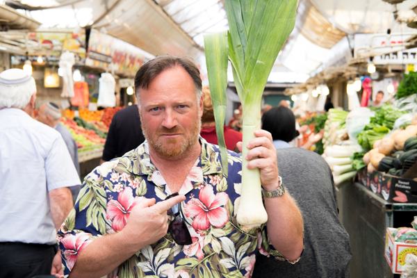 Joel Haber, a culinary tour guide in Jerusalem, at a food market