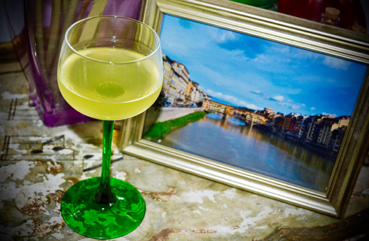 Glass of limoncello with recipe and photo of Florence.