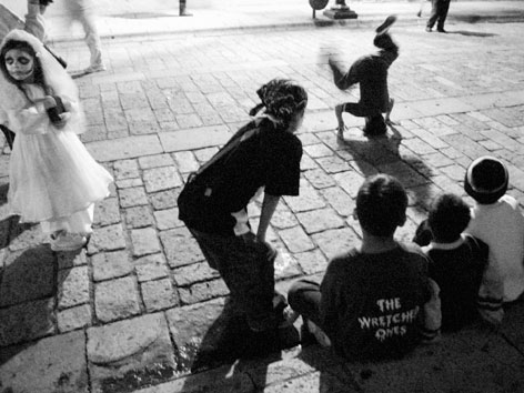 Children breakdancing in the street in Oaxaca