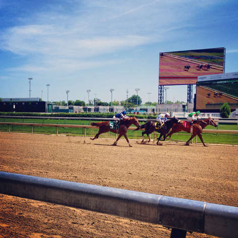 Horses racing at Churchill Downs in Louisville, KY