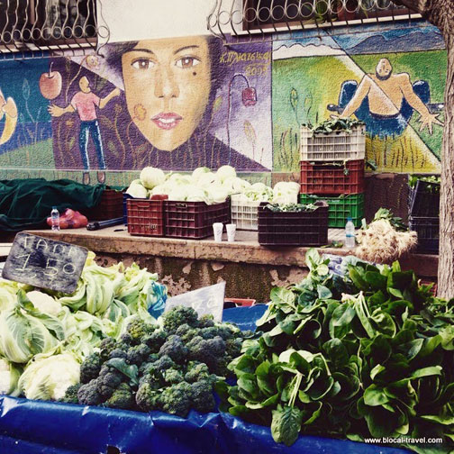 Farmers market stand with murals at Exarchia in Athens, Greece