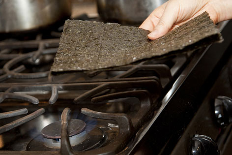 Heating nori (dried seaweed) for sushi