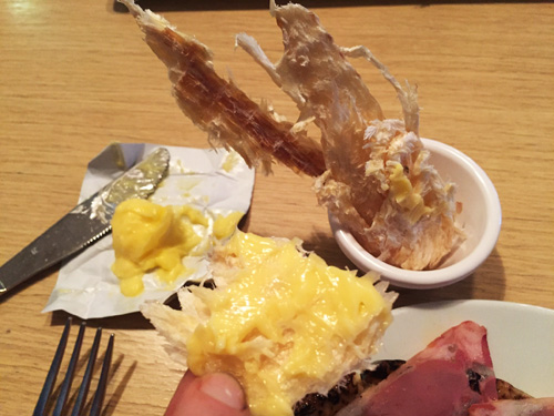 A serving of harofiskur dried fish spread with butter at an Iceland restaurant. 