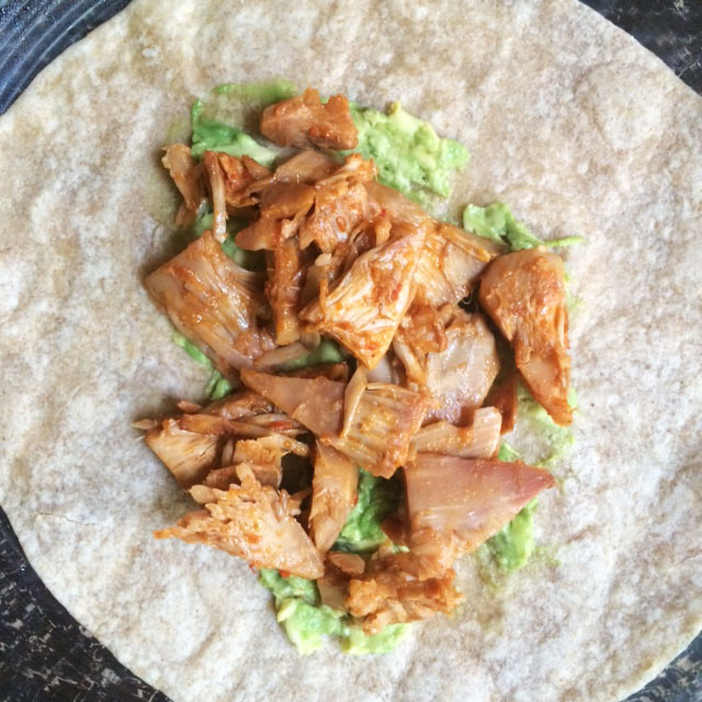 Carnitas-style jackfruit in a tortilla