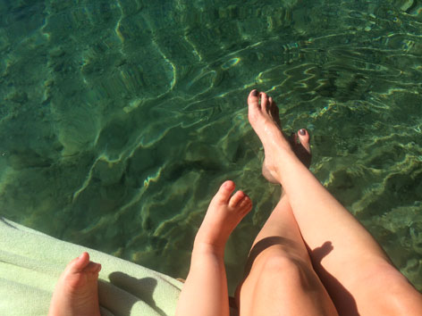 Mom and baby feet in the Blue Lagoon, Jamaica