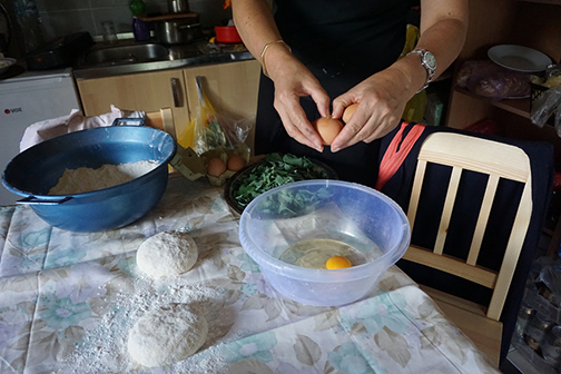 Preparing the cheese and greens filling for Bosnia burek, or pita