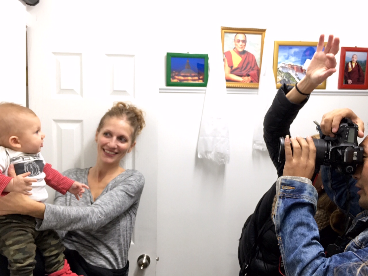 Infant getting passport picture taken in Queens