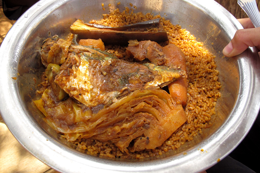 A bowl of homemade family-style ceebu jen,  or thiéboudienne, in Popenguine, Senegal