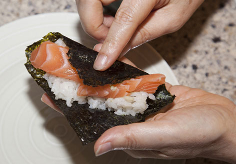 Rolling temaki sushi at home