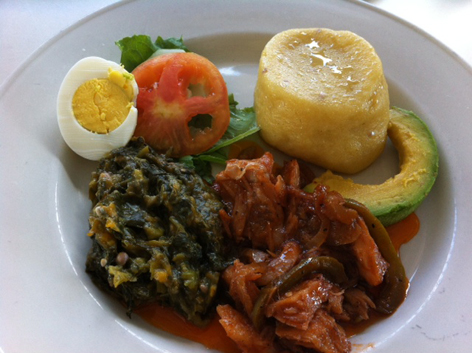 Typical breakfast in Antigua, with ling fish, fungee, and chop-up