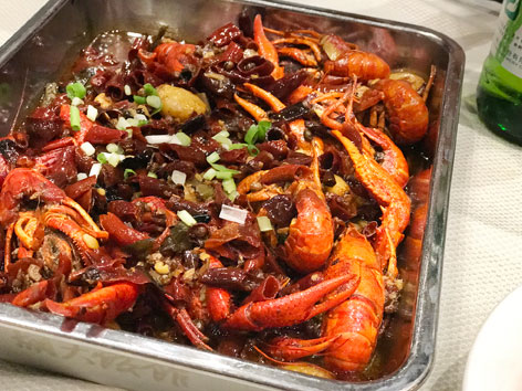 A big platter of spicy crayfish from a seafood restaurant in Beijing, China.