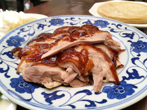 A plate of Peking duck with pancakes from an iconic Beijing restaurant. 