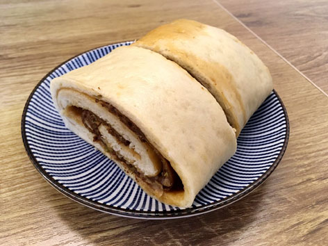 Roulong, a traditional big steamed dumpling, from Beijing.