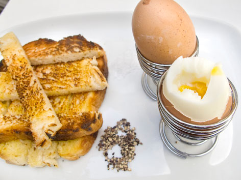 Boiled eggs and soldiers, or sliced toast, from a London cafe, England