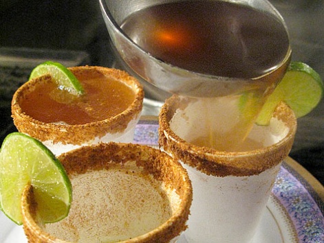 Pouring a hot cup of canelazo into a cup in La Calera, Bogota, Colombia.