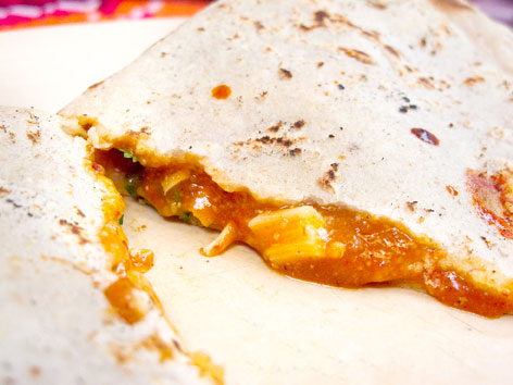 An empanada con mole amarillo at Fonda Florecita in Oaxaca, Mexico.