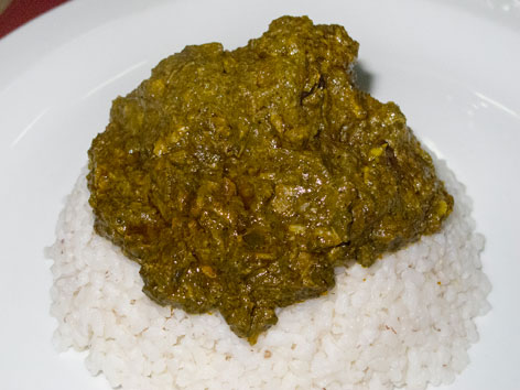 A Sierra Leonean cassava leaf plasa stew from a restaurant in Freetown, Sierra Leone