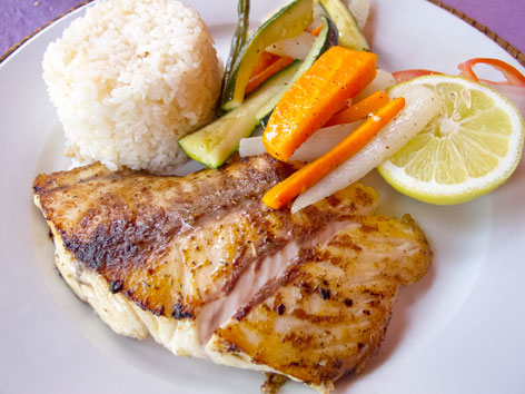 A plate of filet de carpe rouge, a local fish, in Dakar, Senegal. 