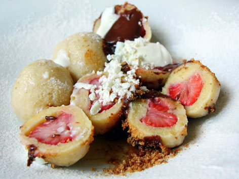 A serving of ovocné knedlíky, or sweet fruit dumplings, from Cafe Savoy in Prague, Czech Republic