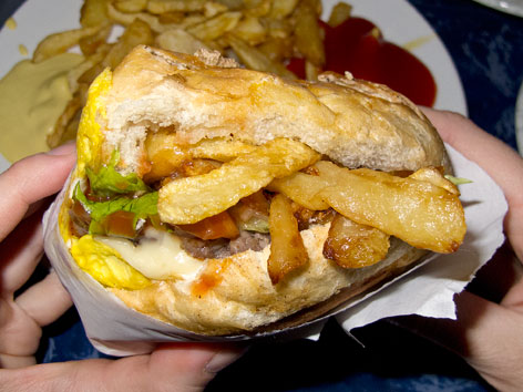 Close-up of a Senegalese-style hamburger, from Chez Joe in Dakar, Senegal