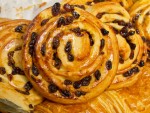 A pile of fresh chelsea buns from The Flour Station in London, England.