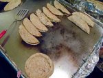 Quesadillas cooking on a comal in Mexico City.