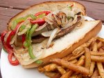 A sausage and peppers sandwich with fries from Sawmill Cafe on the Seaside Boardwalk.